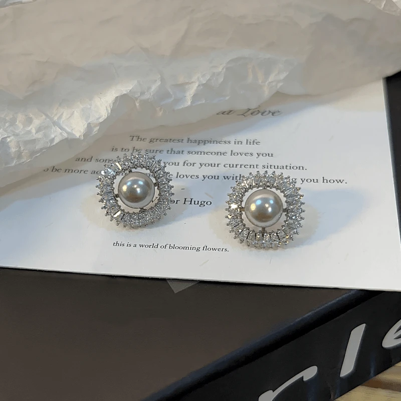 Close-up detail of the sparkling zircons and plating on the Gray Square Stud Earrings