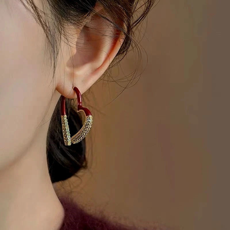 Close-up detail of the sparkling zircons and plating on the Zircon Heart Earrings