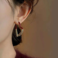 Close-up detail of the sparkling zircons and plating on the Zircon Heart Earrings