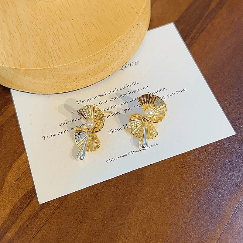 Angled view of the 14K Gold-Plated Fan-Shaped Beaded Earrings