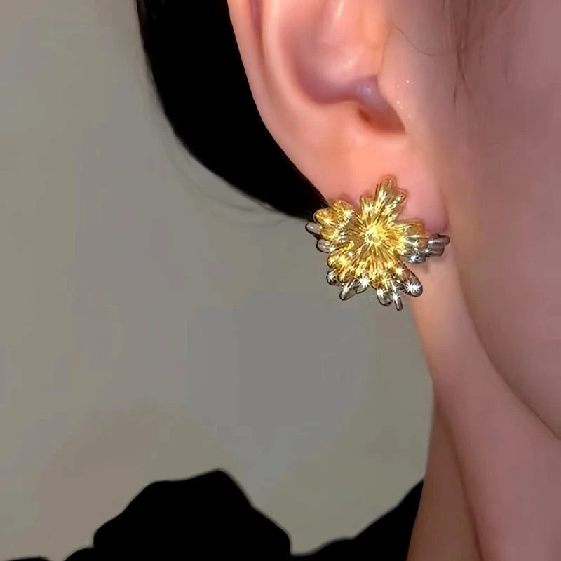 Close-up detail of the sparkling zircons and plating on the Fireworks Flower Earrings