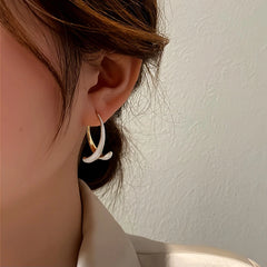 Angled view of the 14K Gold-Plated Fishtail Earrings