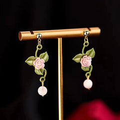 Close-up detail of the sparkling zircons and plating on the Green Leaf Earrings