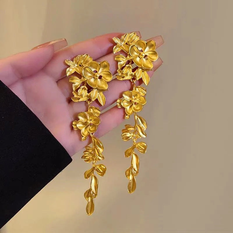 Close-up detail of the sparkling zircons and plating on the Leaf Tassel Earrings