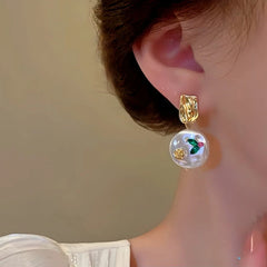 Close-up detail of the sparkling zircons and plating on the Baroque Pearl Earrings