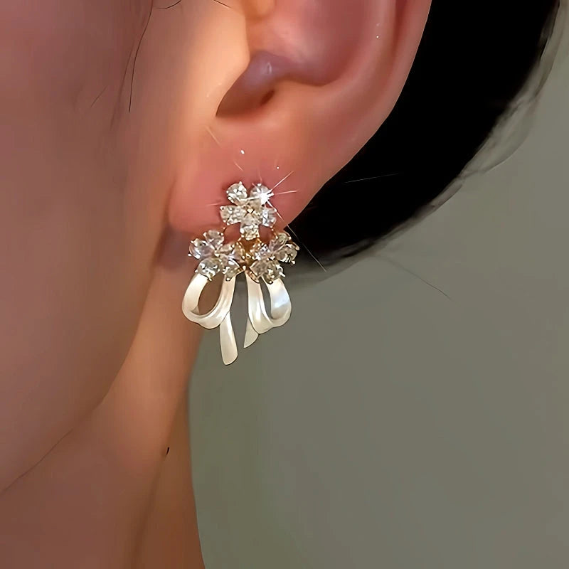 Close-up detail of the sparkling zircons and plating on the Flower Bow Earrings