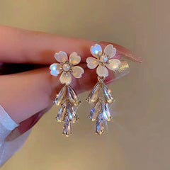 Angled view of the 14K Gold-Plated Flower Diamond Tassel Earrings