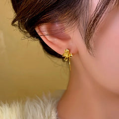 Close-up detail of the sparkling zircons and plating on the Flower Threader Earrings