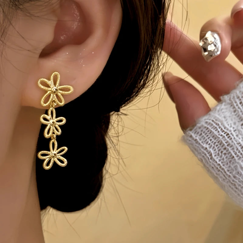 Close-up detail of the sparkling zircons and plating on the Knot Tassel Earrings