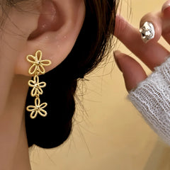 Close-up detail of the sparkling zircons and plating on the Knot Tassel Earrings