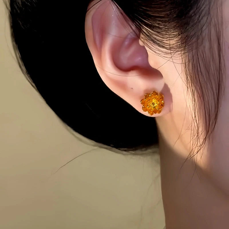 Model showcasing the dangle and style of the 14K Gold-Plated Flower Pearl Earrings