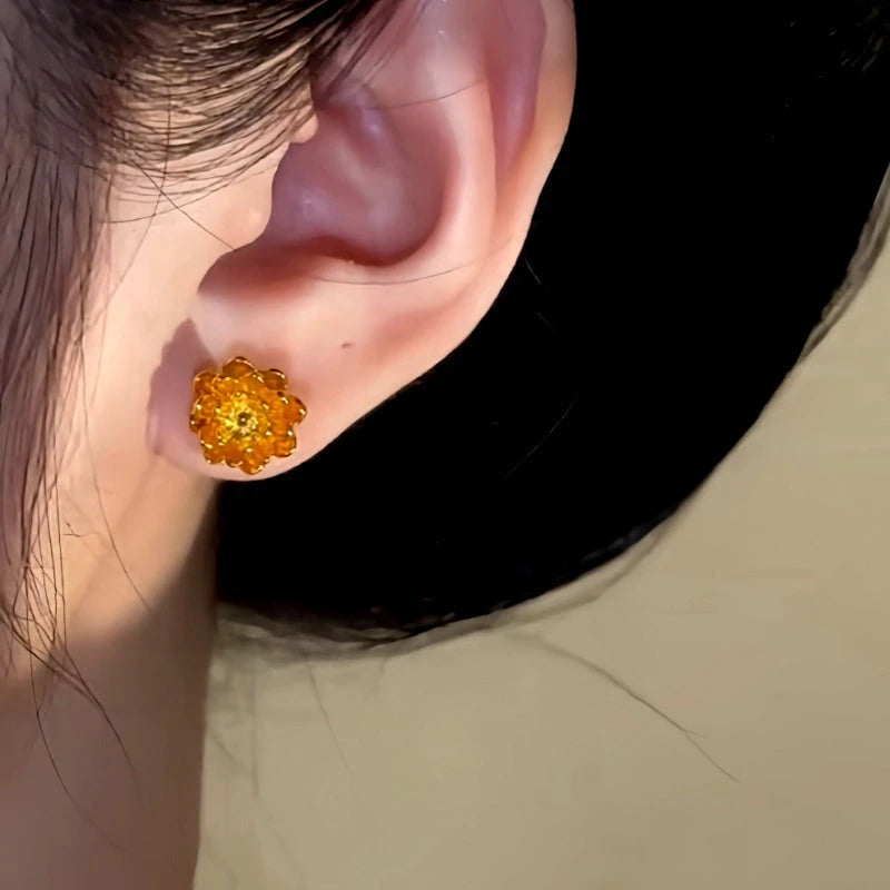 Close-up detail of the sparkling zircons and plating on the Flower Pearl Jacket Earrings