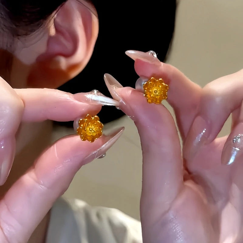 Angled view of the 14K Gold-Plated Flower Pearl Earrings