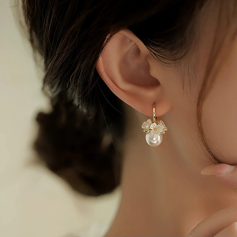 Close-up detail of the sparkling zircons and plating on the Flower Pearl Earrings
