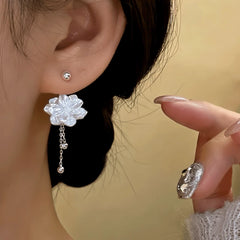 Close-up detail of the sparkling zircons and plating on the Screw Jacket Earrings