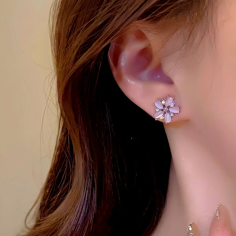 Close-up detail of the sparkling zircons and plating on the Pink Flower Tassel Earrings