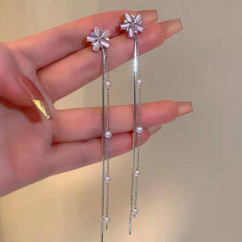 Angled view of the 14K Gold-Plated Flower Tassel Earrings