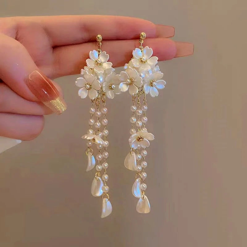 Angled view of the 14K Gold-Plated Flower Tassel Earrings