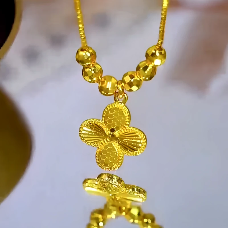 Close-up of the pendant and clasp on the Clover Pendant Necklace