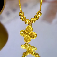 Close-up of the pendant and clasp on the Clover Pendant Necklace