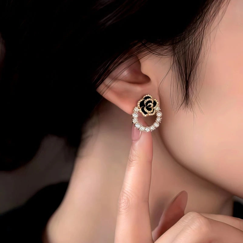 Close-up detail of the sparkling zircons and plating on the Camellia Pearl Earrings