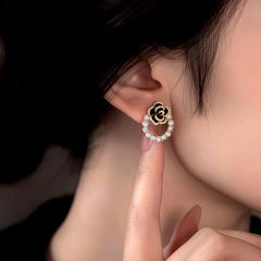 Close-up detail of the sparkling zircons and plating on the Camellia Pearl Earrings