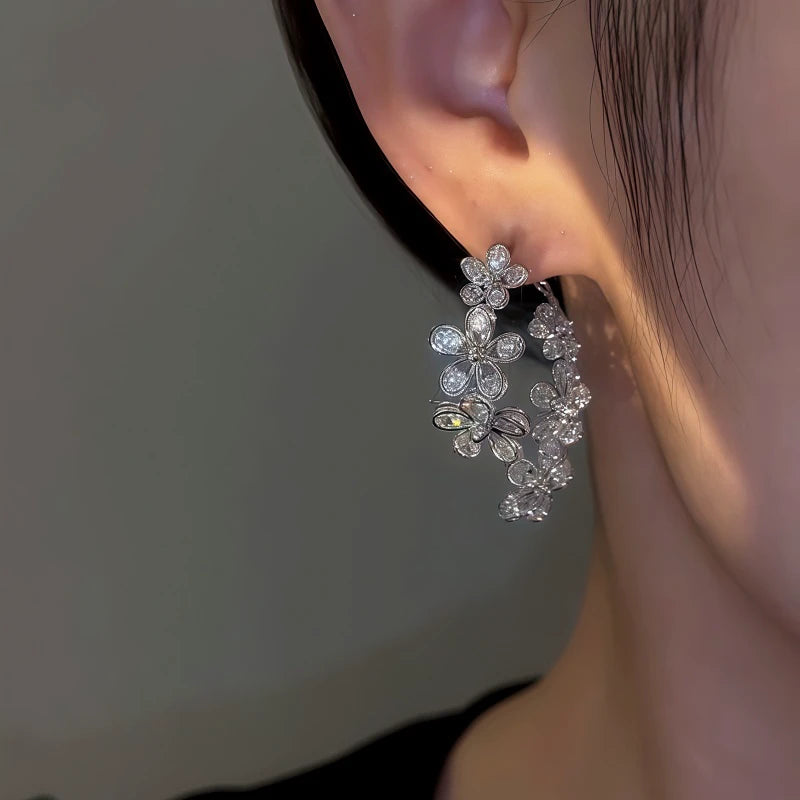 Close-up detail of the sparkling zircons and plating on the Zircon Flower Earrings