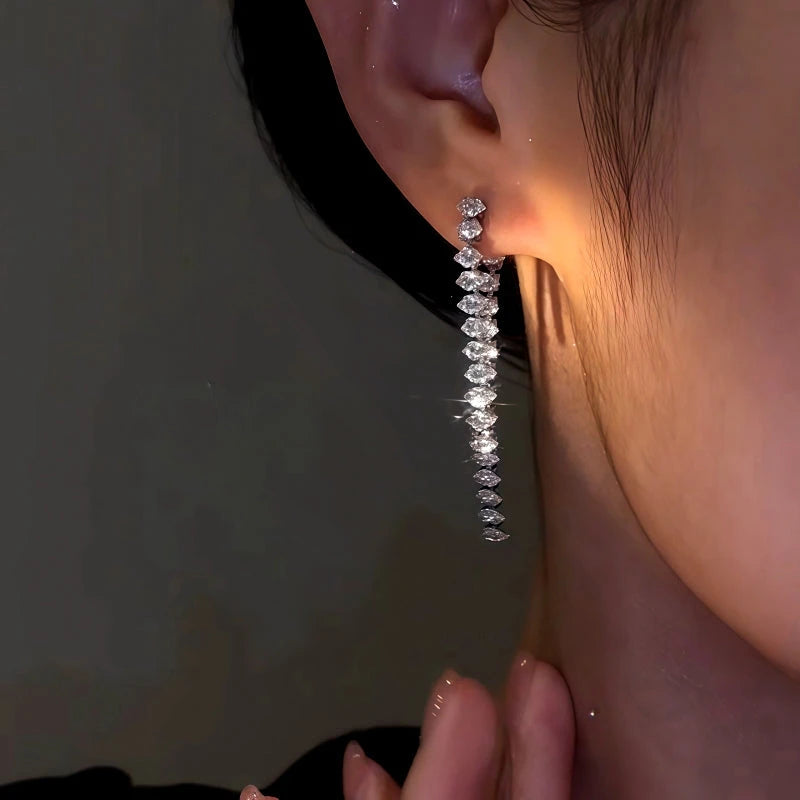 Close-up detail of the sparkling zircons and plating on the Zircon Tassel Earrings