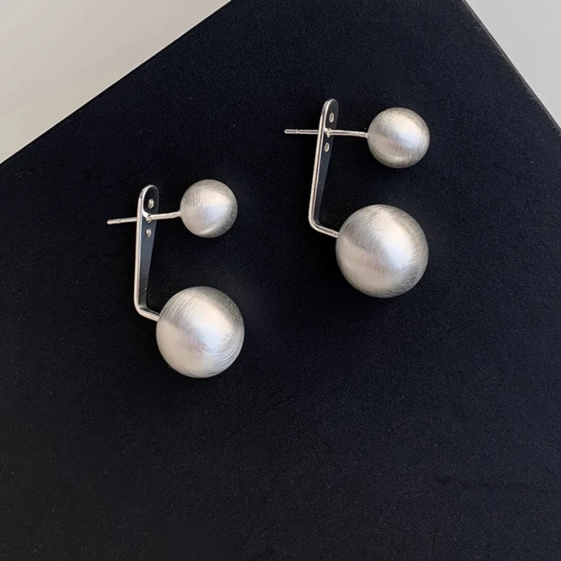 Close-up detail of the sparkling zircons and plating on the Frosted Ball Earrings