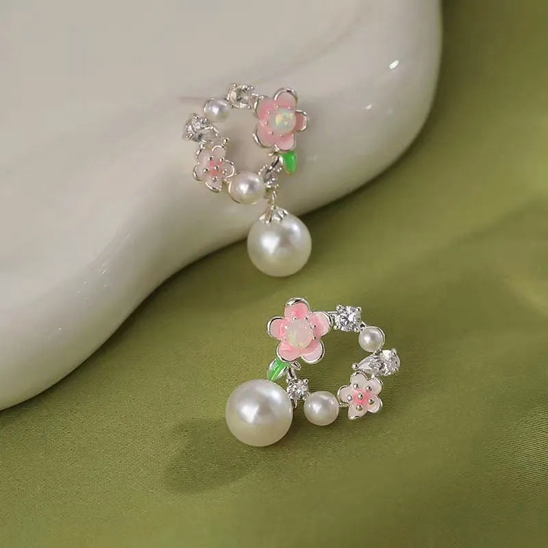 Angled view of the 14K Gold-Plated Garland Pearl Earrings