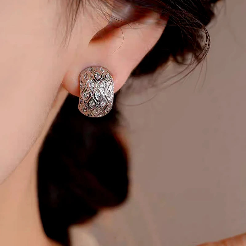 Close-up detail of the sparkling zircons and plating on the Geometric Hoop Earrings