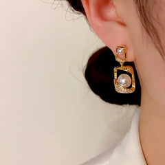 Close-up detail of the sparkling zircons and plating on the Geometric Pearl Drops