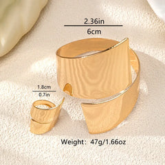 Close-up of the clasp and charm details on the Geometric Cuff Set