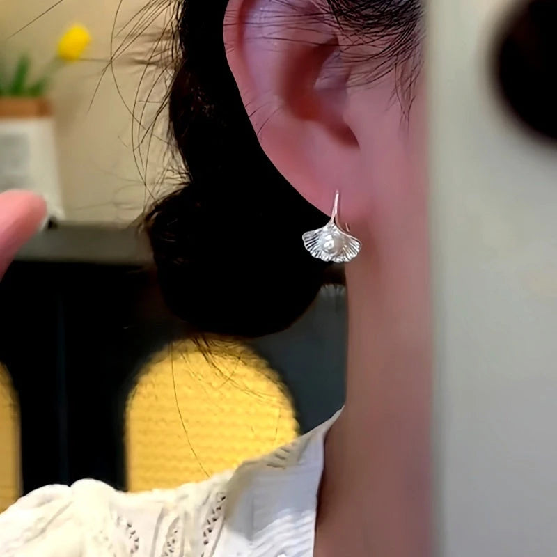 Close-up detail of the sparkling zircons and plating on the Ginkgo Leaf Ear Hooks