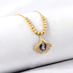 Close-up of the pendant and clasp on the Ginkgo Leaf Necklace