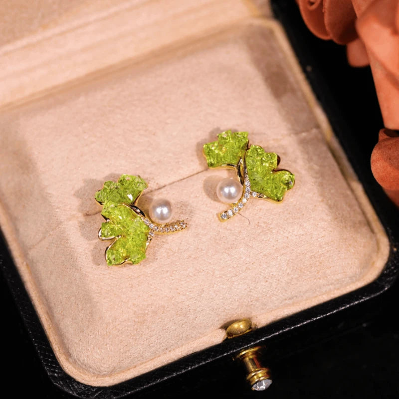 Angled view of the 14K Gold-Plated Ginkgo Leaf Pearl Earrings