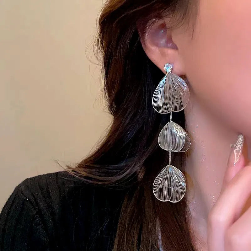 Close-up detail of the sparkling zircons and plating on the Ginkgo Tassel Earrings