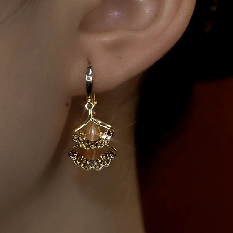 Close-up detail of the sparkling zircons and plating on the Brown Ginkgo Tassel