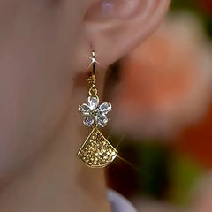 Close-up detail of the sparkling zircons and plating on the Ginkgo Leaf Earrings