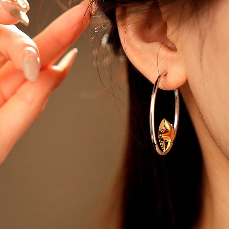 Angled view of the 14K Gold-Plated Golden Star Hoop Earring
