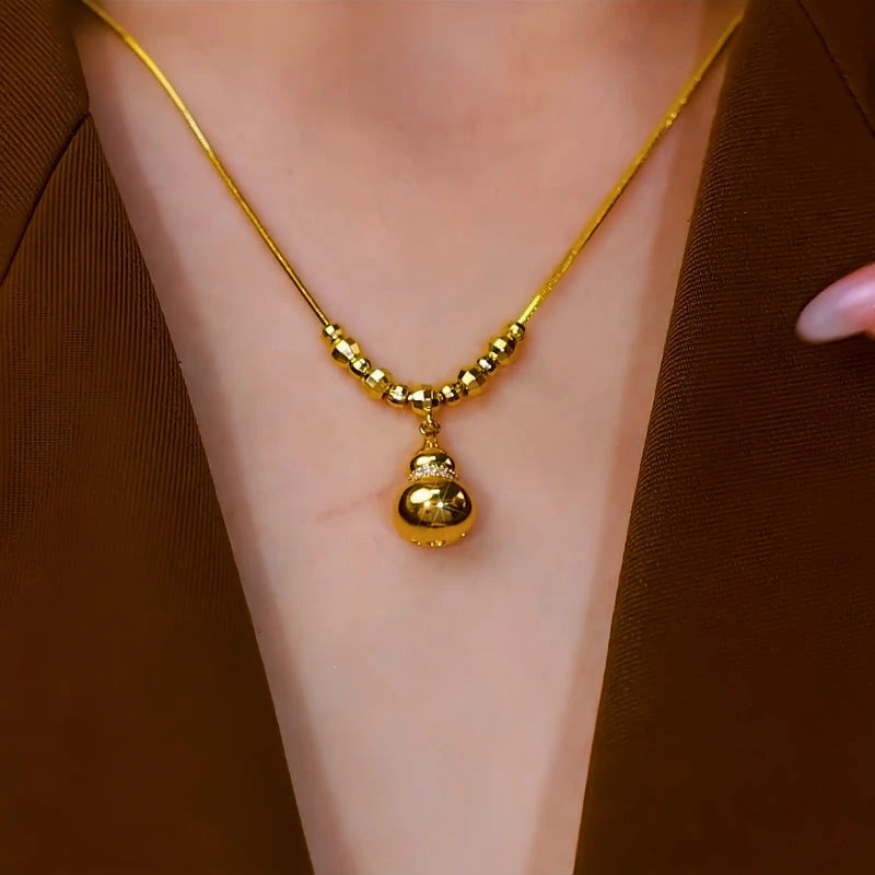 14K Gold-Plated Gourd Necklace worn to showcase its length and pendant detail