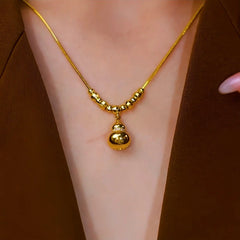 14K Gold-Plated Gourd Necklace worn to showcase its length and pendant detail