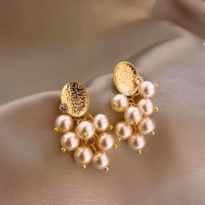 Angled view of the 14K Gold-Plated Grapes Pearl Tassel Earrings