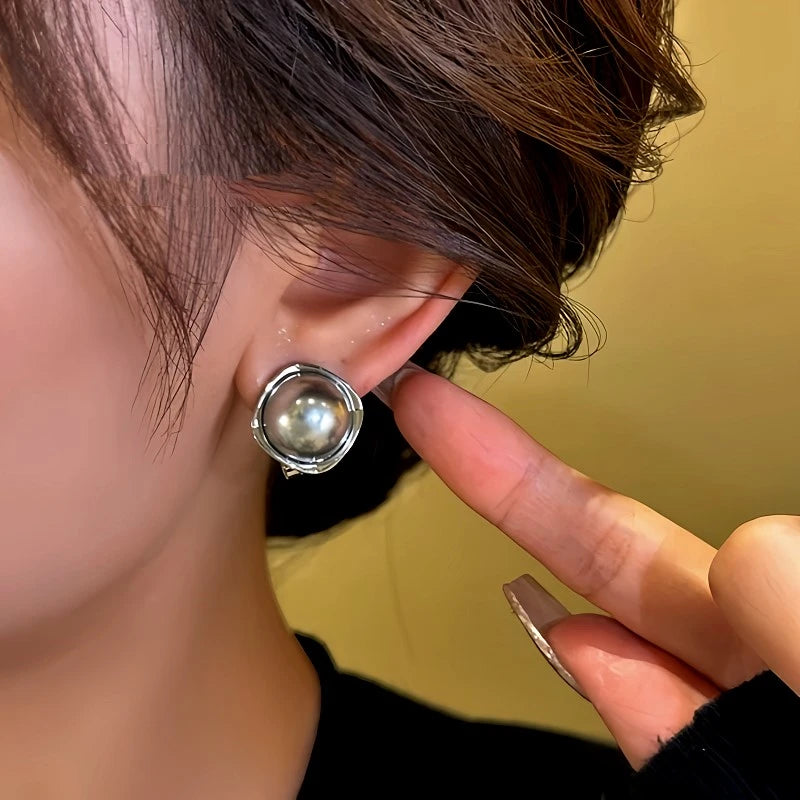 Model showcasing the dangle and style of the 14K Gold-Plated Gray-Tone Bead Earrings