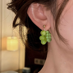 Close-up detail of the sparkling zircons and plating on the Green Bead Earrings