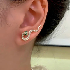 Model showcasing the dangle and style of the 14K Gold-Plated Green Diamond Snake Crawler