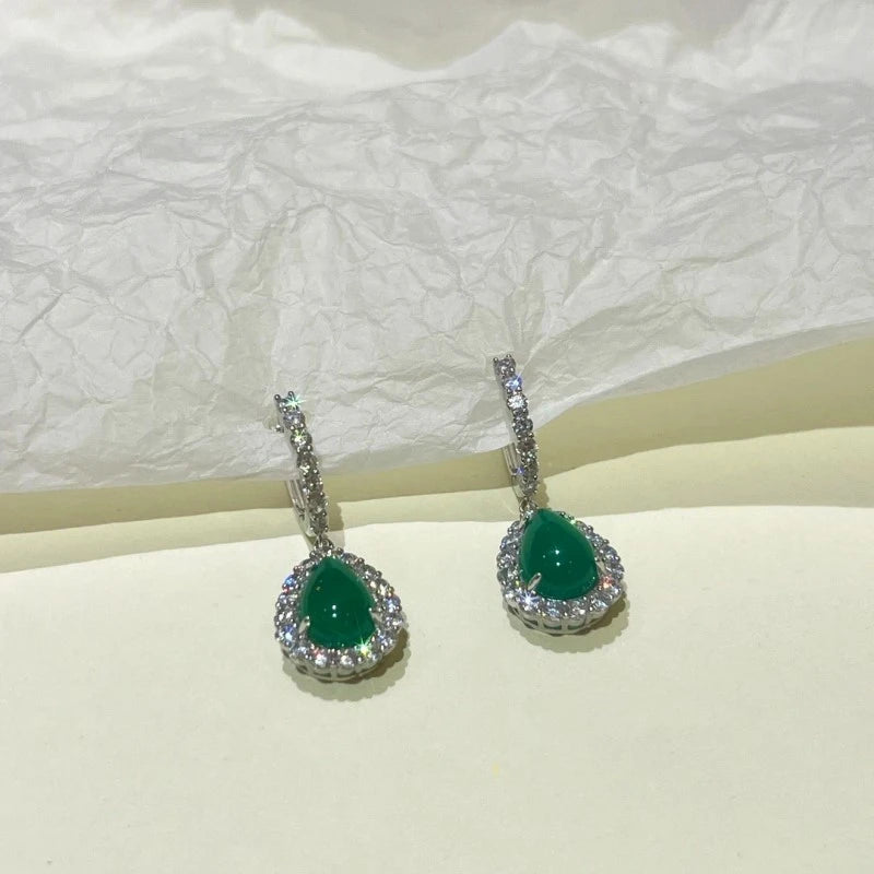 Angled view of the 14K Gold-Plated Green Diamond Water Drop Earrings