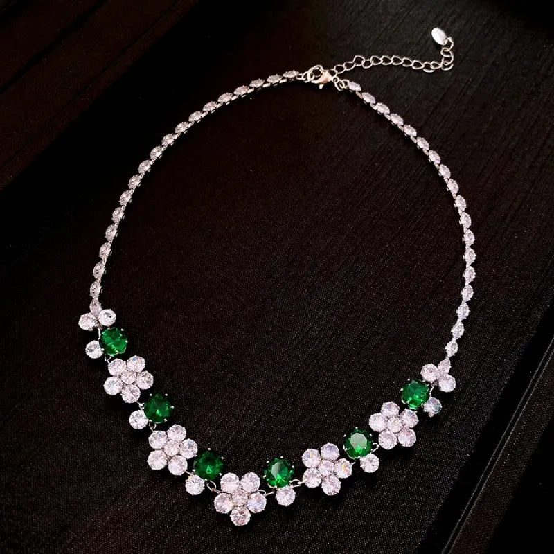 Detailed view of the 14K Gold-Plated Green Diamond Zircon Flower Necklace And Earring Set chain and pendant