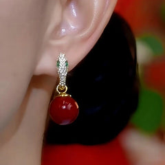 Close-up detail of the sparkling zircons and plating on the Snake Pearl Earrings