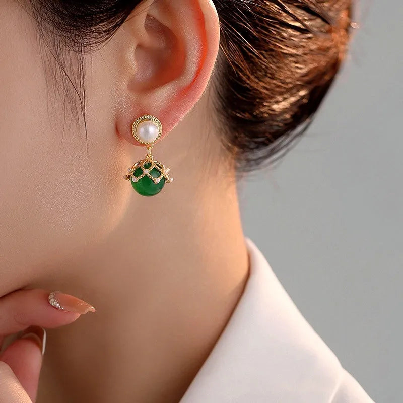 Close-up detail of the sparkling zircons and plating on the Forest Green Pearl